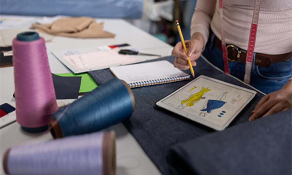 a designer working on a dress pattern onelovedress 1